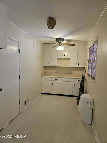 a kitchen with stainless steel appliances a stove and a refrigerator