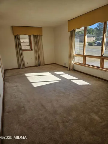 an empty room with windows