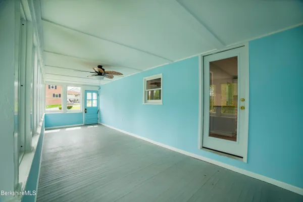 a view of an empty room with a window