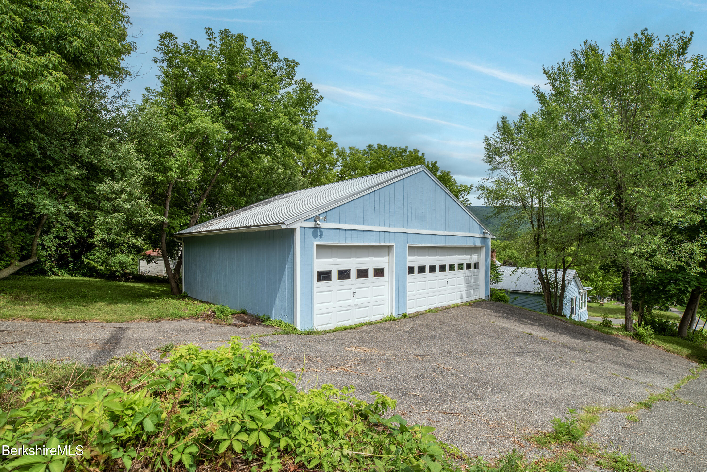 7 Hughes Street Adams, MA 01220 - Photo 21 of 22 front view of a house with a yard