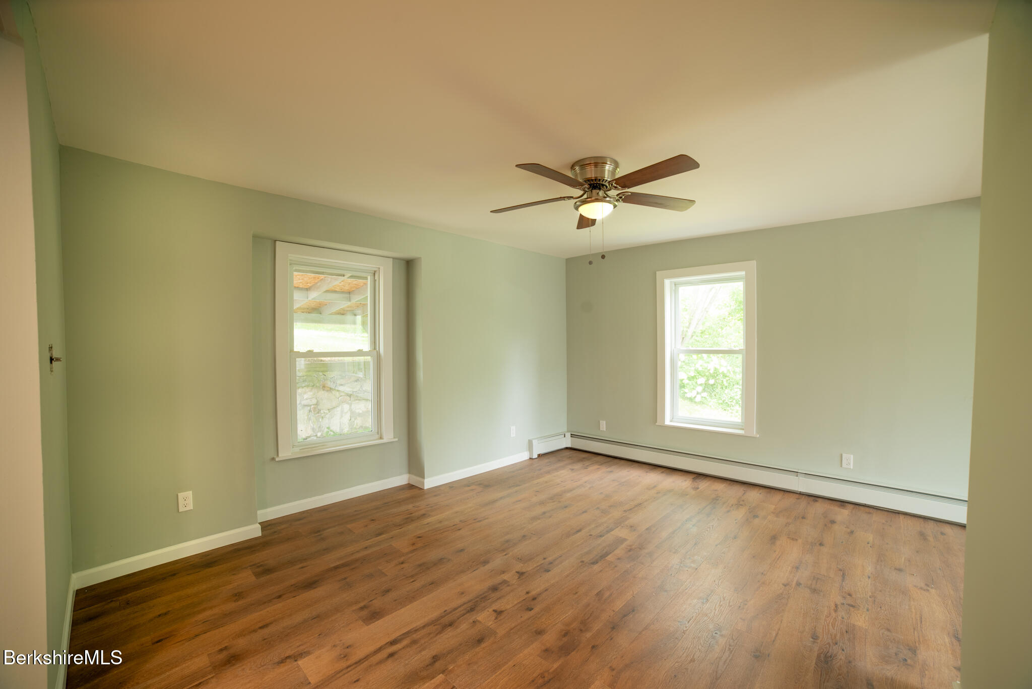 7 Hughes Street Adams, MA 01220 - Photo 7 of 22 a view of an empty room with a window and wooden floor