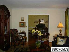 3031 Wickersham Road Charlotte, NC 28211 - Photo 2 of 8 a living room with furniture and flowers