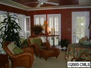 3031 Wickersham Road Charlotte, NC 28211 - Photo 5 of 8 a living room with furniture and a potted plant