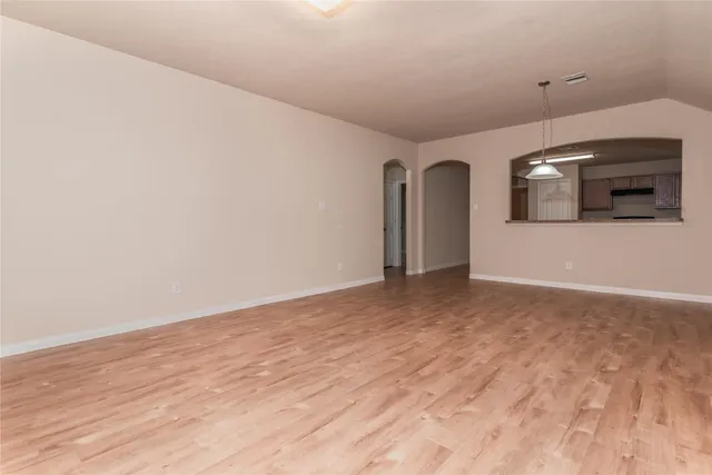 a view of a livingroom with wooden floor