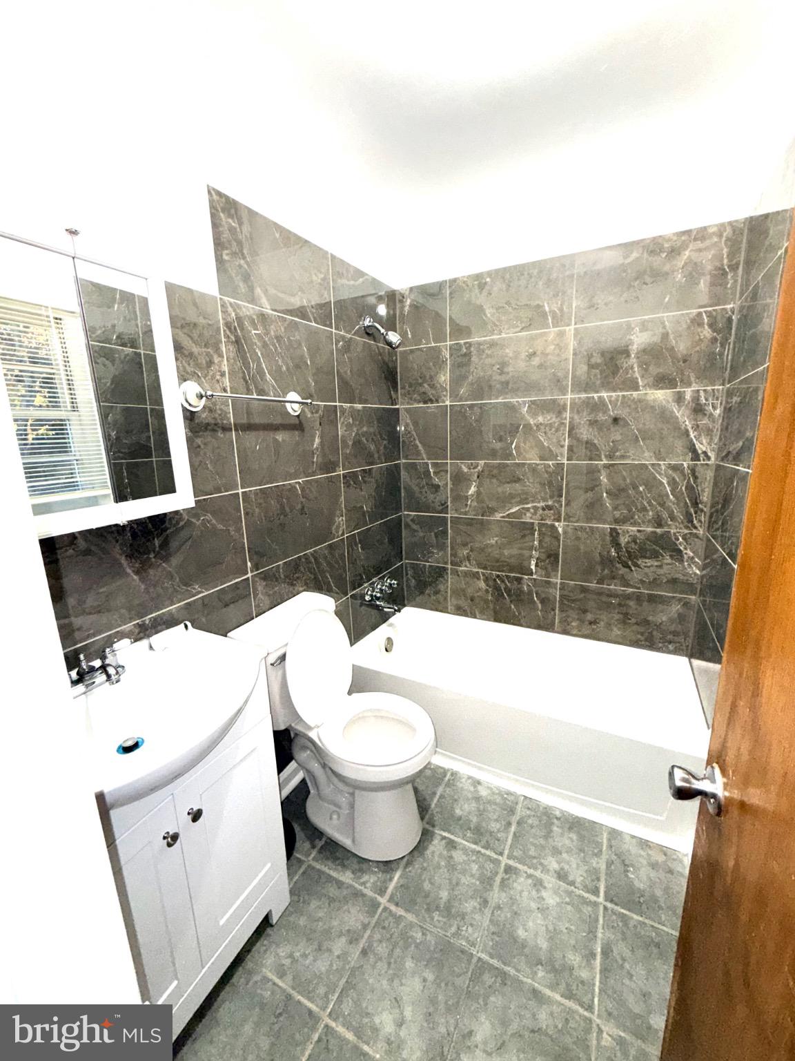 35972 Washington Avenue Chaptico, MD 20621 - Photo 4 of 11 Modern bathroom with sleek tile accents.