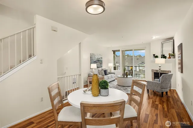 a view of a dining room with furniture window and wooden floor