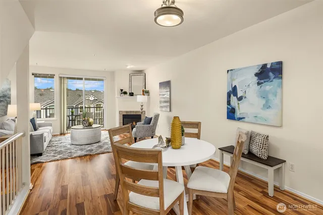 a view of a dining room with furniture wooden floor and a rug