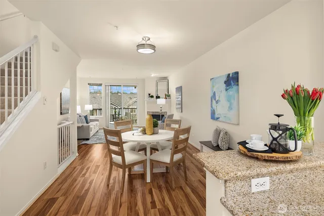 a view of a dining room with furniture window and wooden floor