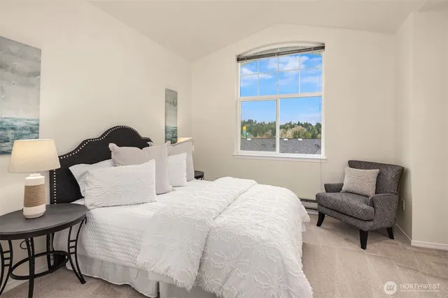 a bedroom with bed and window