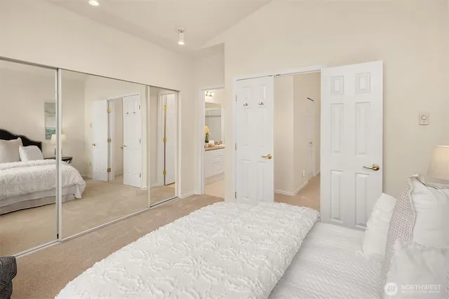 a bedroom with a bed and a closet