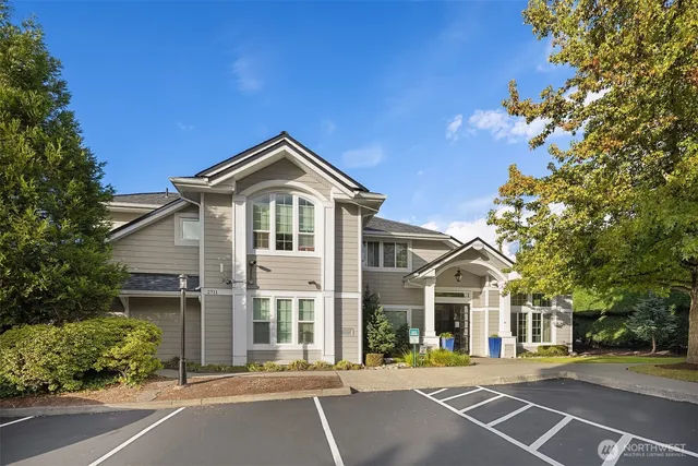 a front view of a building with trees