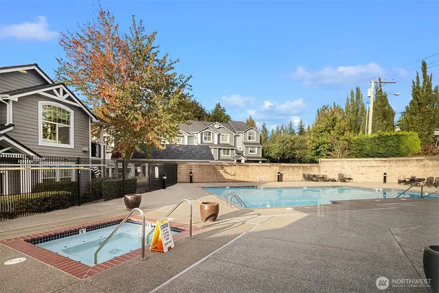 a view of a swimming pool with a lounge chairs