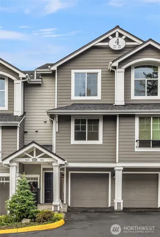 a front view of a house with garage