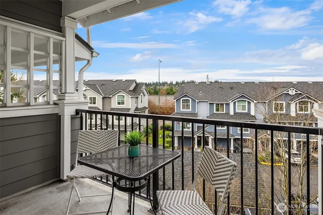 a view of a balcony with furniture