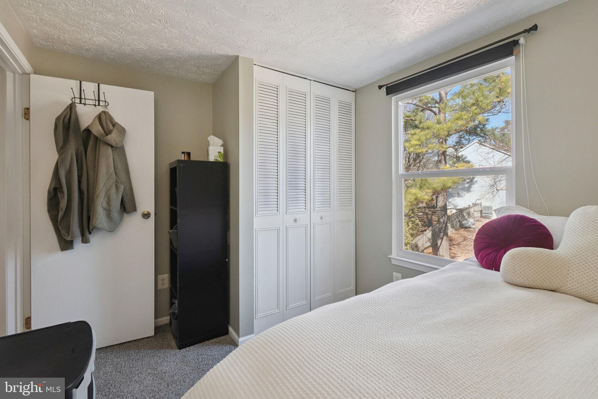15057 Mill Spring Drive Dumfries, VA 22025 - Photo 12 of 20 a bedroom with a bed and a window