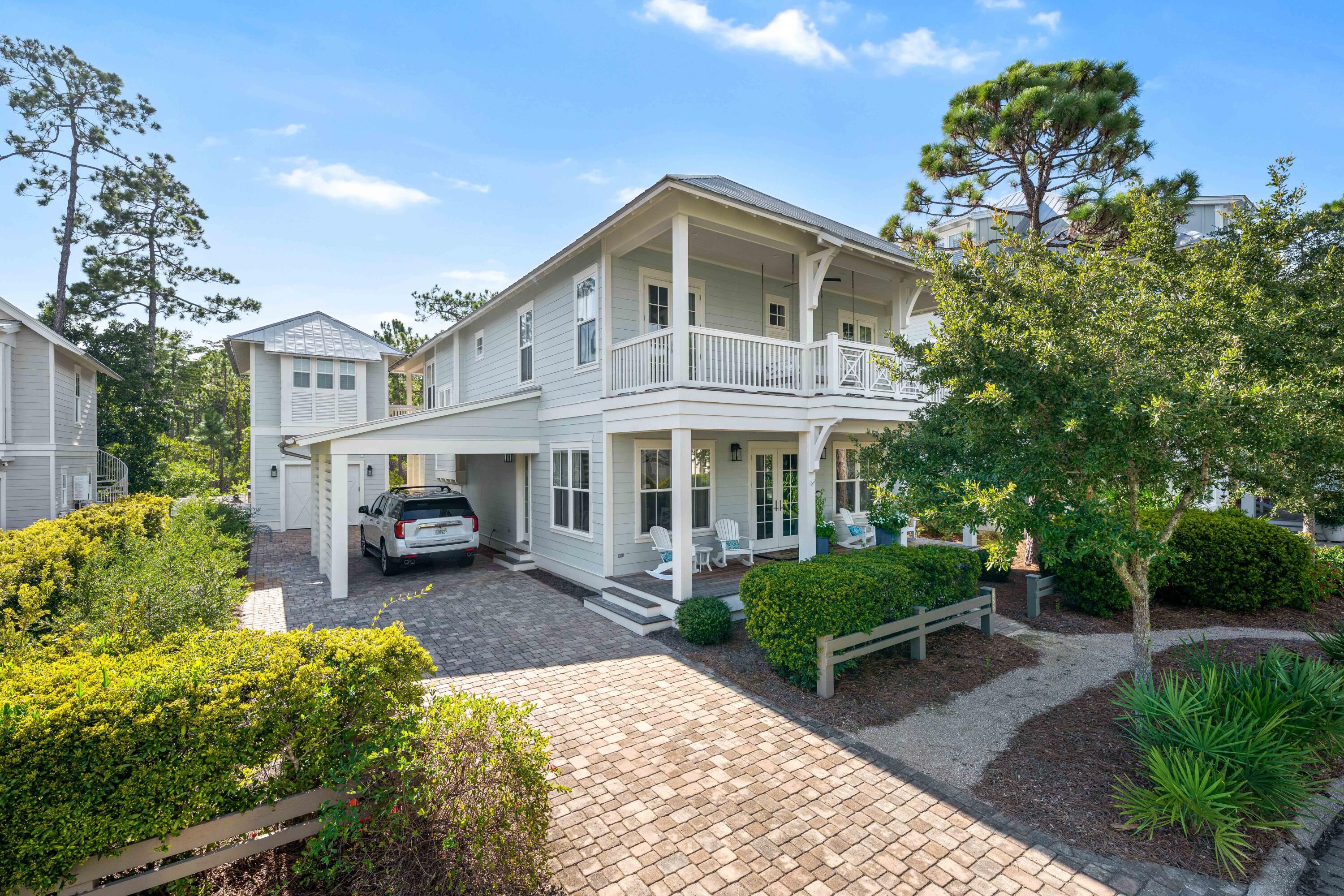 655 East Royal Fern Way Santa Rosa Beach, FL 32459 - Photo 1 of 75 a front view of a house with garden and patio