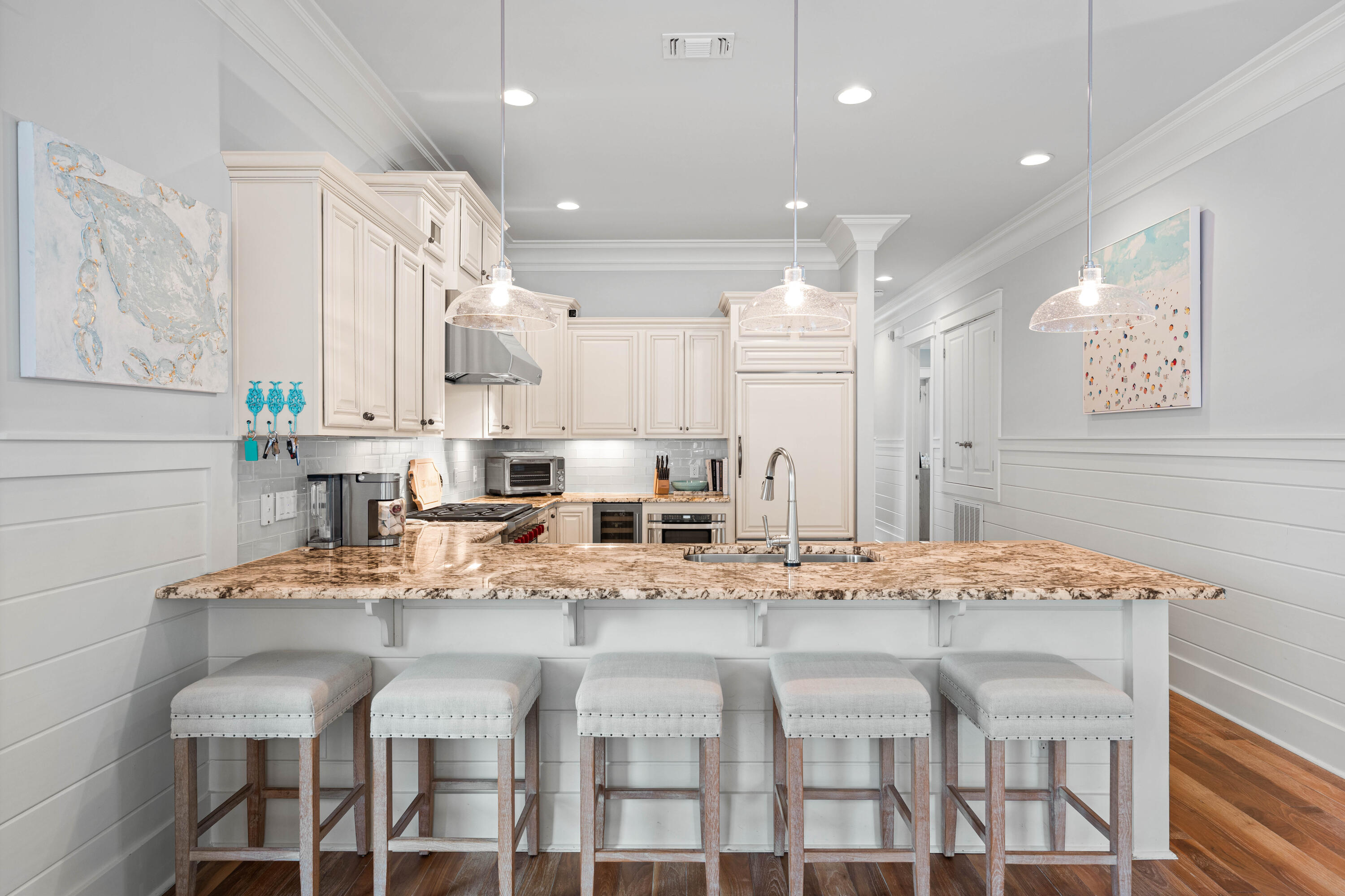 655 East Royal Fern Way Santa Rosa Beach, FL 32459 - Photo 12 of 75 a kitchen with stainless steel appliances kitchen island granite countertop a kitchen island and chairs in it