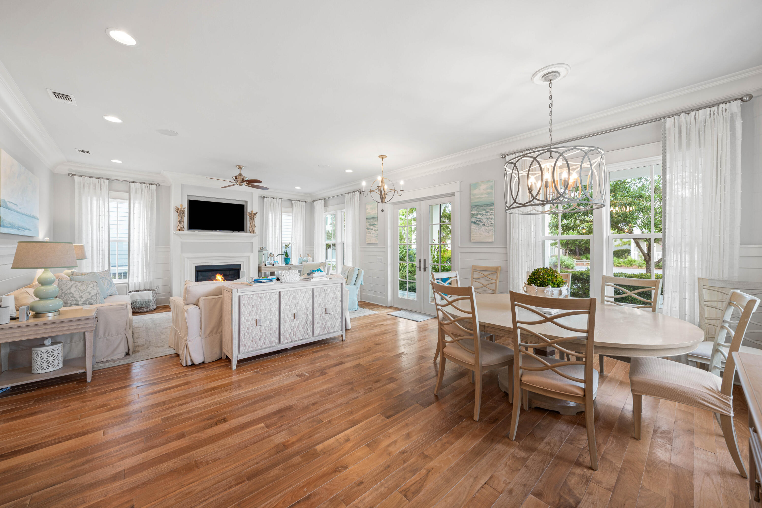 655 East Royal Fern Way Santa Rosa Beach, FL 32459 - Photo 13 of 75 a living room with furniture a flat screen tv and a floor to ceiling window