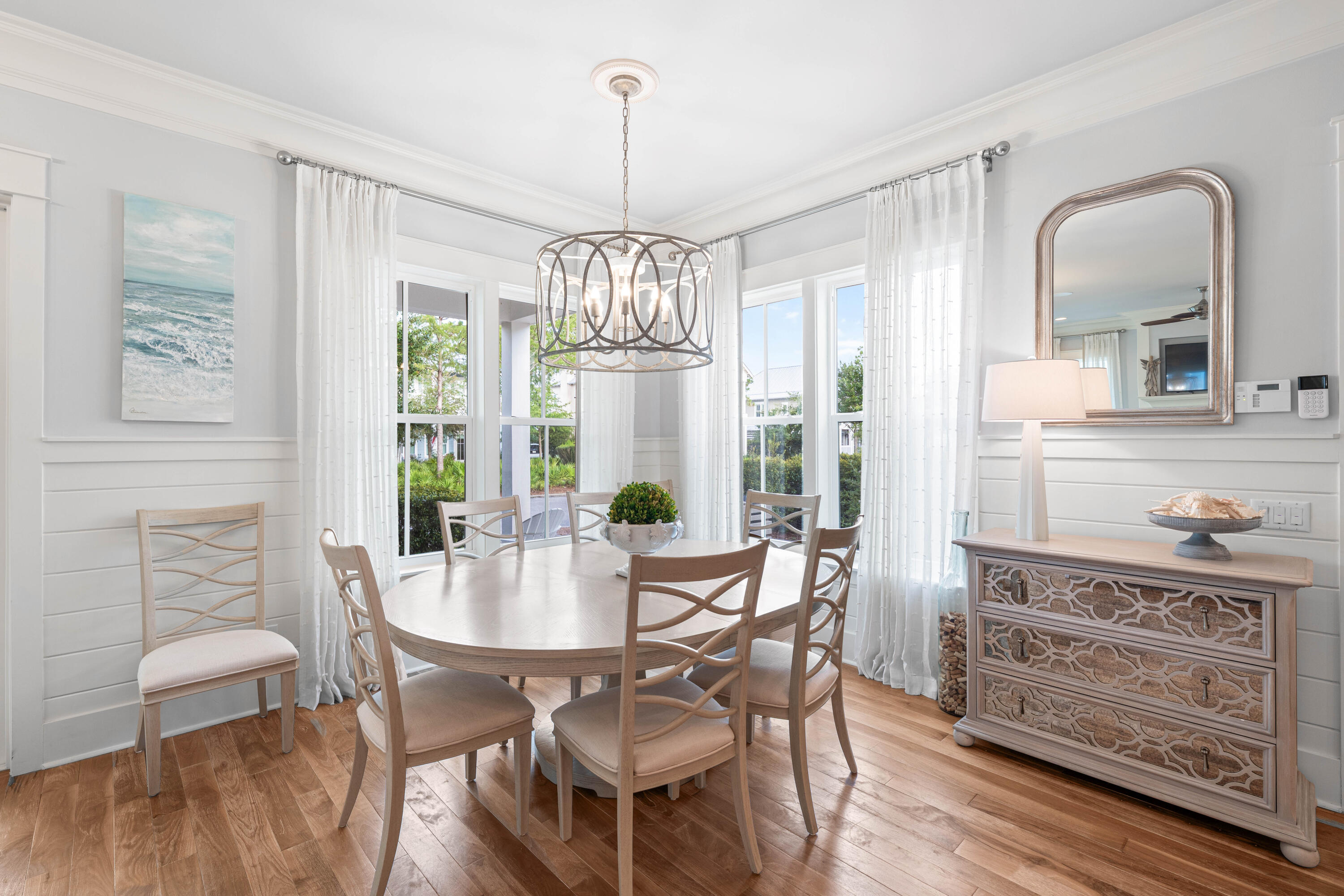 655 East Royal Fern Way Santa Rosa Beach, FL 32459 - Photo 14 of 75 a view of a dining room with furniture window and wooden floor