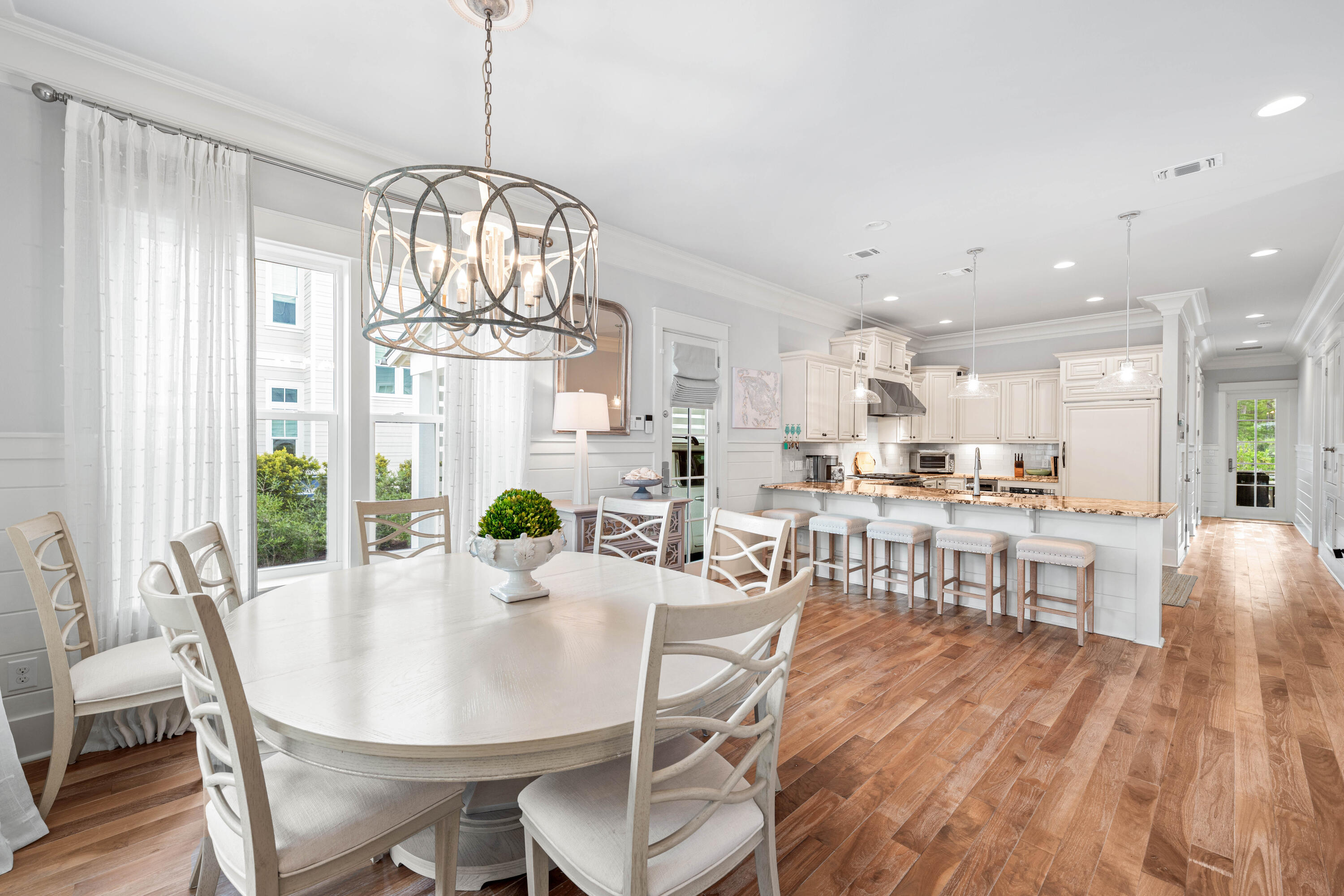 655 East Royal Fern Way Santa Rosa Beach, FL 32459 - Photo 15 of 75 a view of a dining room with furniture a chandelier and wooden floor