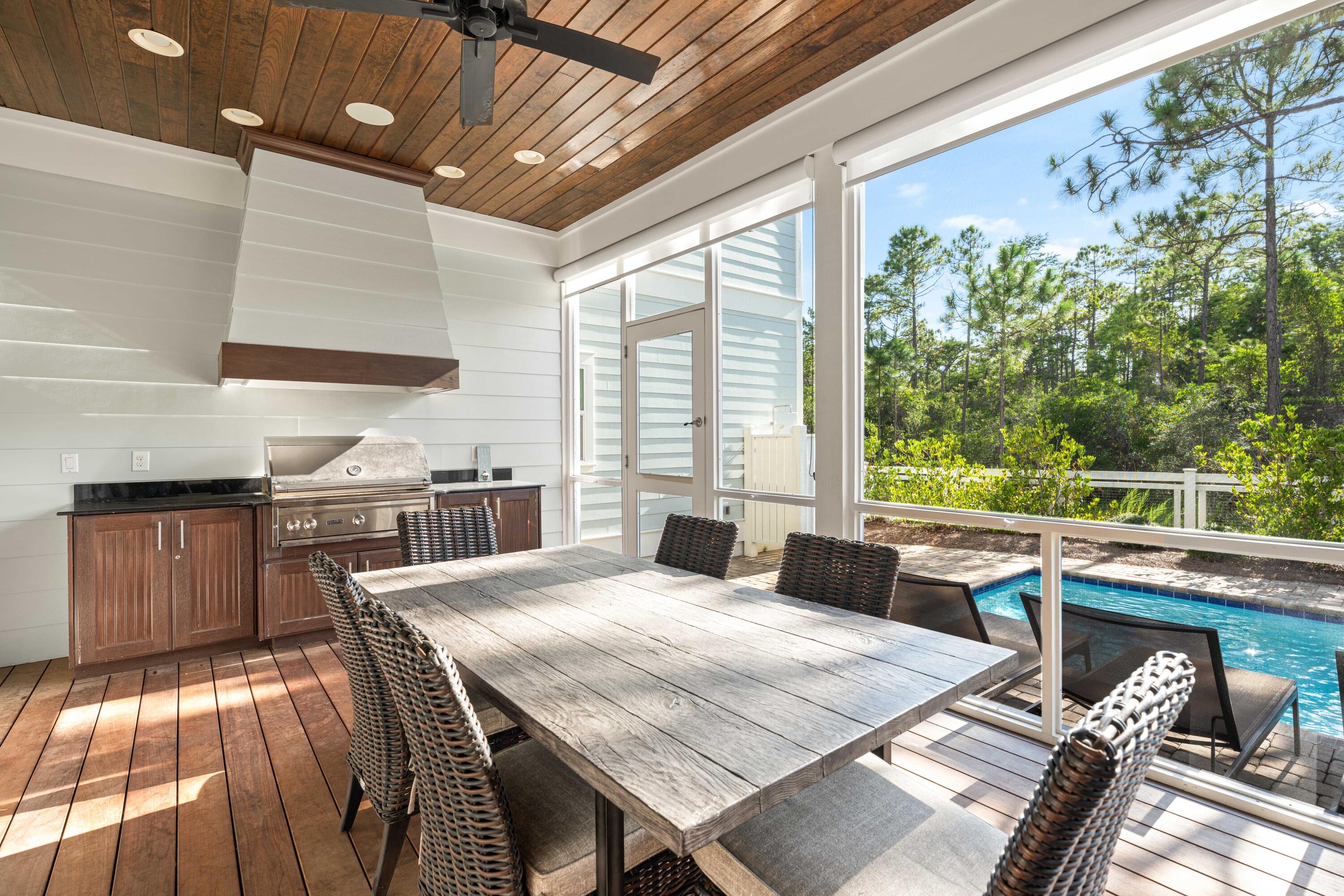 655 East Royal Fern Way Santa Rosa Beach, FL 32459 - Photo 31 of 75 a large kitchen with a table and chairs