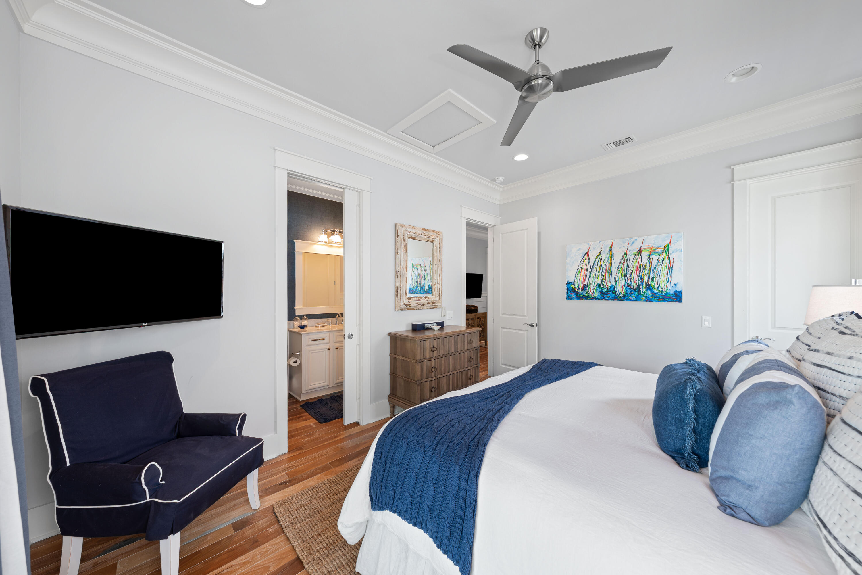 655 East Royal Fern Way Santa Rosa Beach, FL 32459 - Photo 49 of 75 a bedroom with a bed a couch and a flat screen tv