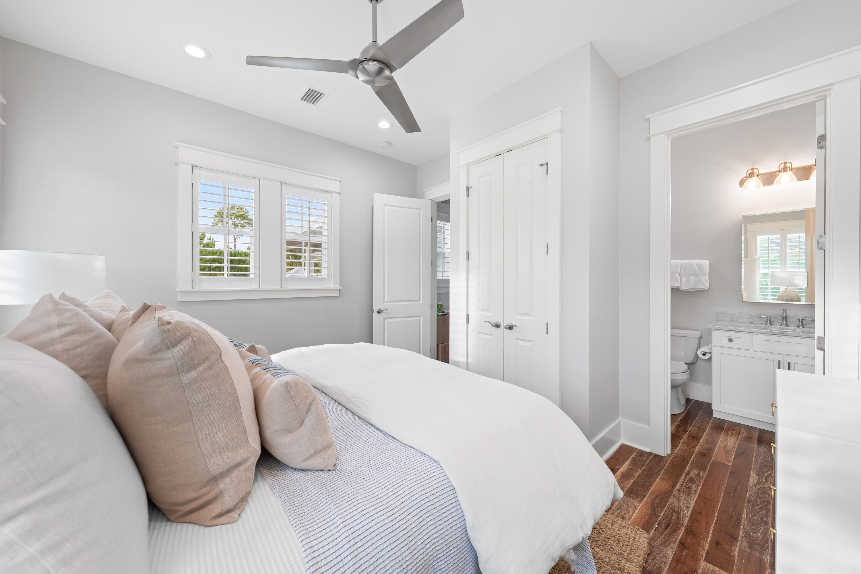 655 East Royal Fern Way Santa Rosa Beach, FL 32459 - Photo 63 of 75 a bedroom with a bed and a mirror