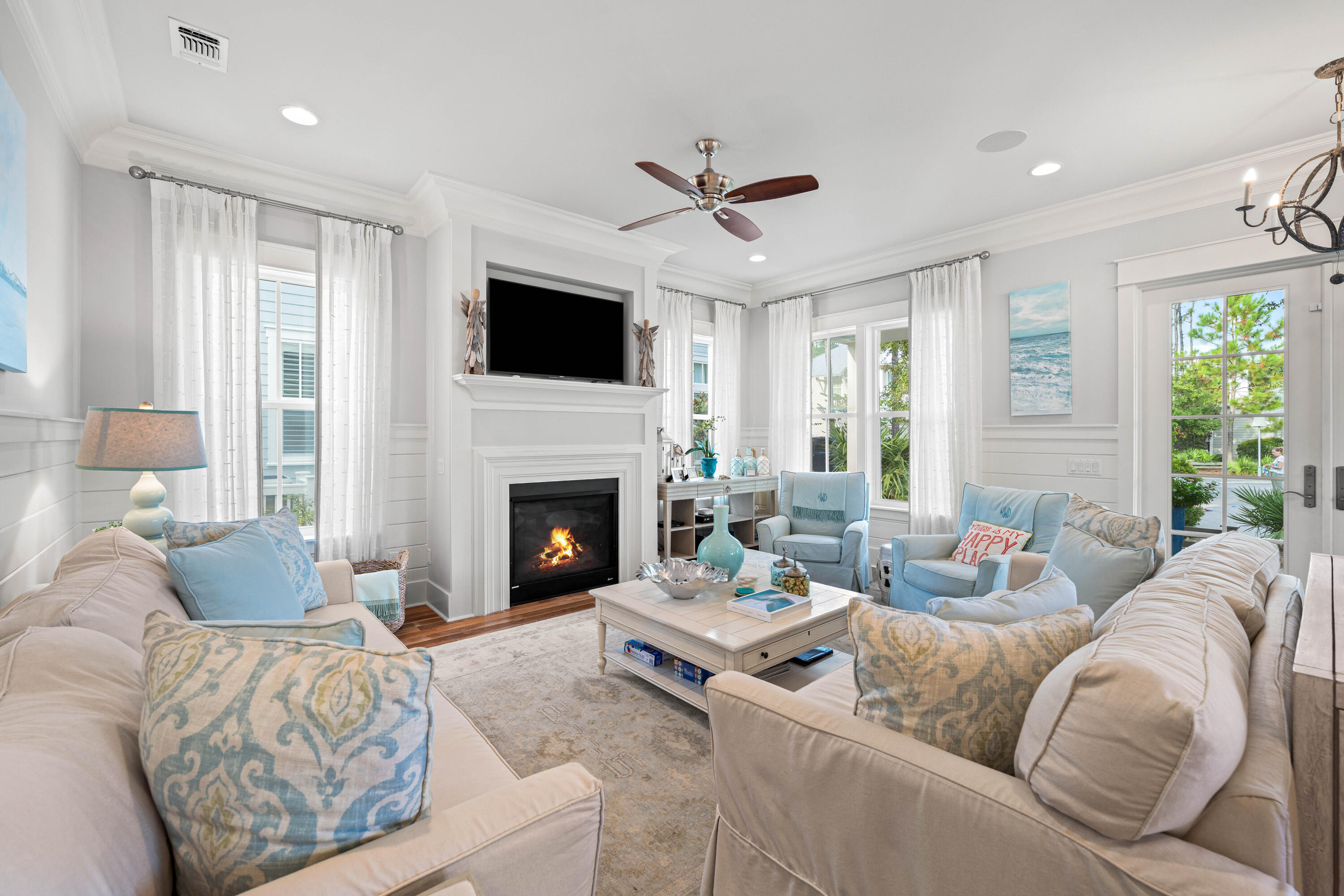 655 East Royal Fern Way Santa Rosa Beach, FL 32459 - Photo 7 of 75 a living room with furniture a fireplace and a flat screen tv