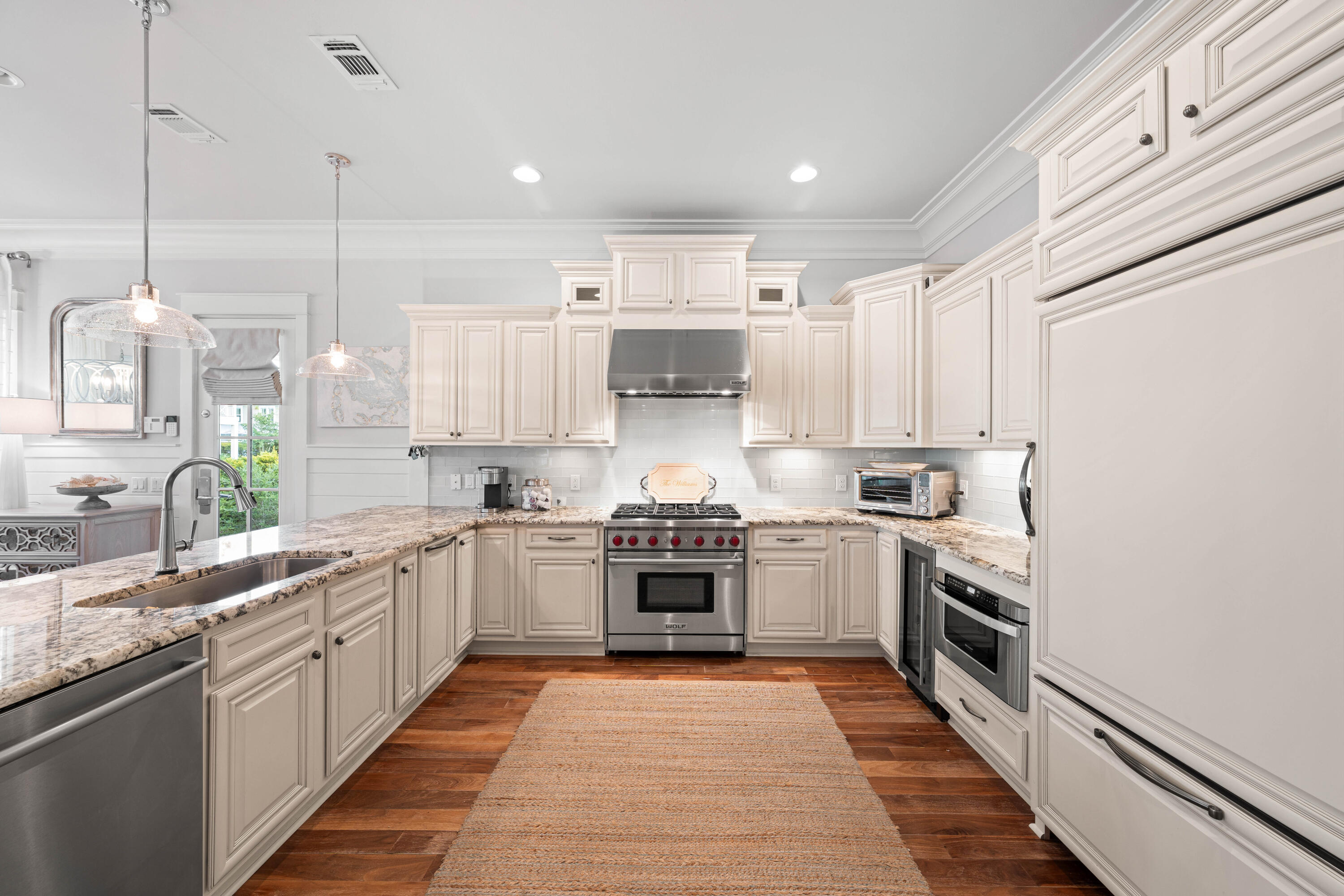 655 East Royal Fern Way Santa Rosa Beach, FL 32459 - Photo 9 of 75 a large kitchen with stainless steel appliances granite countertop a stove and cabinets