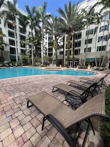 a view of a swimming pool with a yard