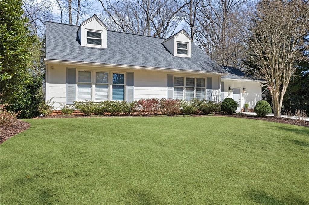 2553 Ridgewood Terrace Northwest Atlanta, GA 30318 - Photo 1 of 1 a front view of a house with garden