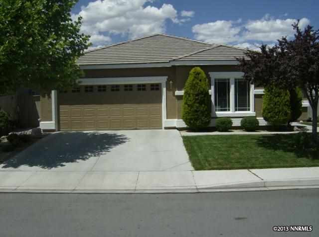 9520 Happy Canyon Drive Reno, NV 89521 - Photo 1 of 1 a front view of a house with a yard
