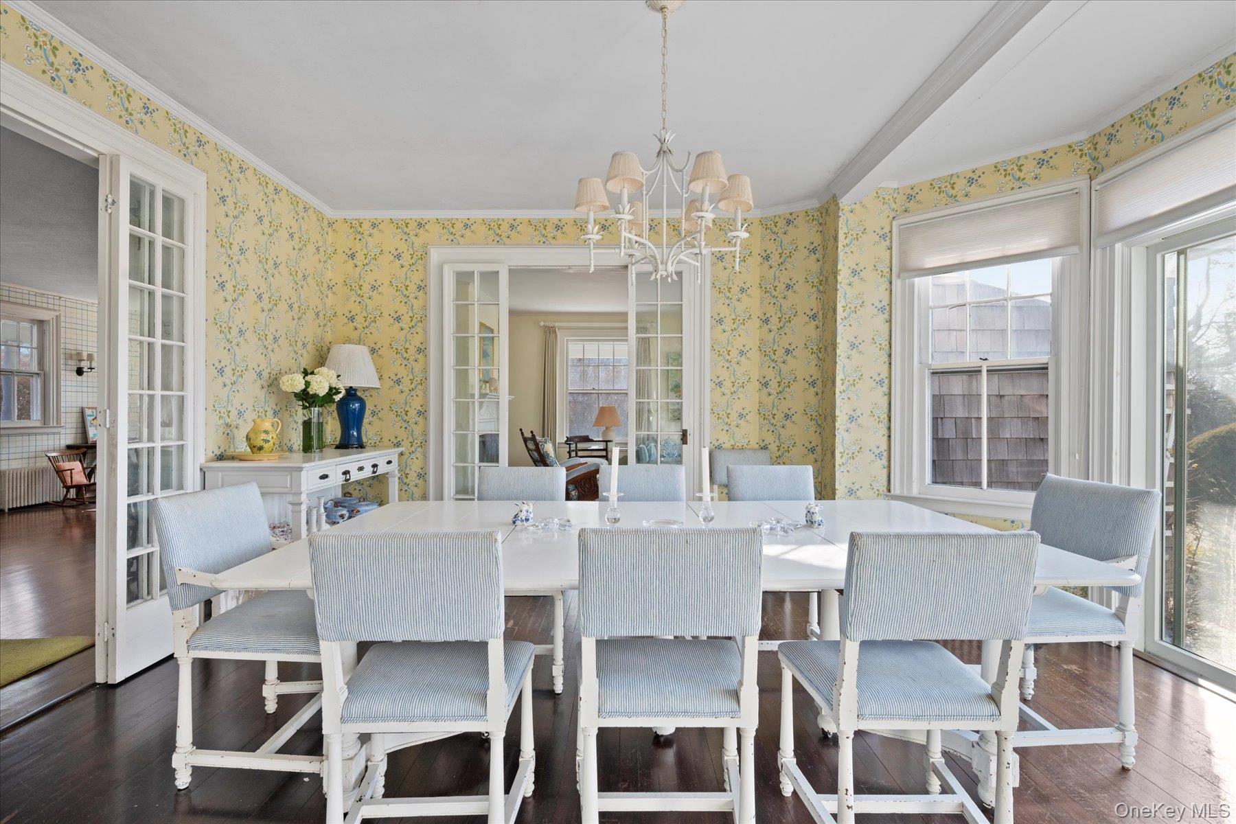 11 Shinnecock Road Quogue, NY 11959 - Photo 14 of 50 a view of a dining room with furniture wooden floor and chandelier