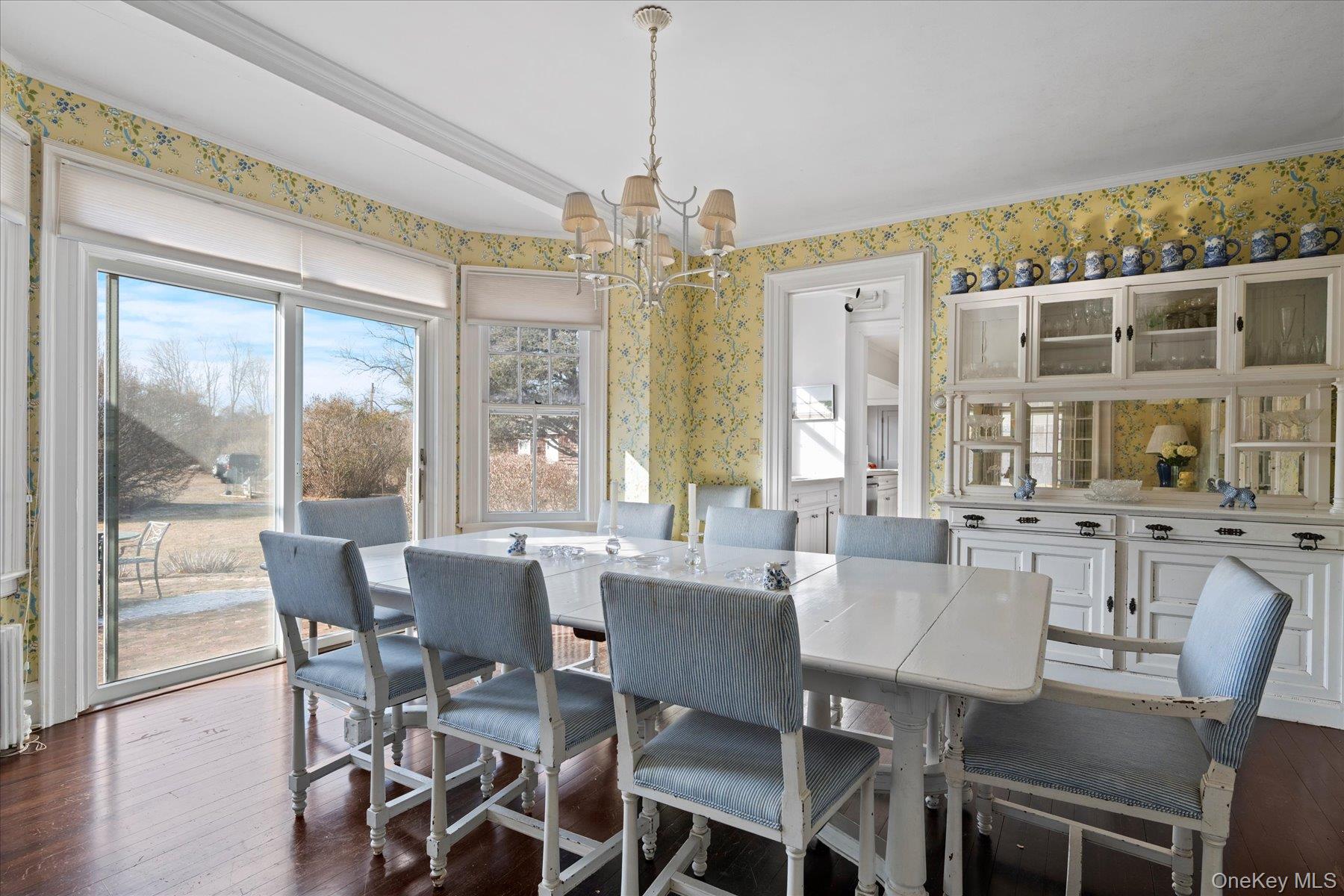 11 Shinnecock Road Quogue, NY 11959 - Photo 15 of 50 a view of a dining room with furniture large windows and wooden floor