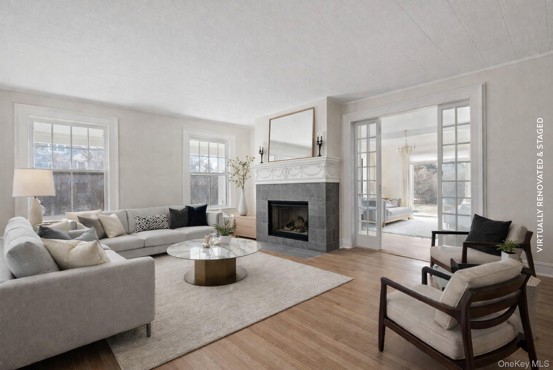 11 Shinnecock Road Quogue, NY 11959 - Photo 16 of 50 a living room with furniture and a fireplace