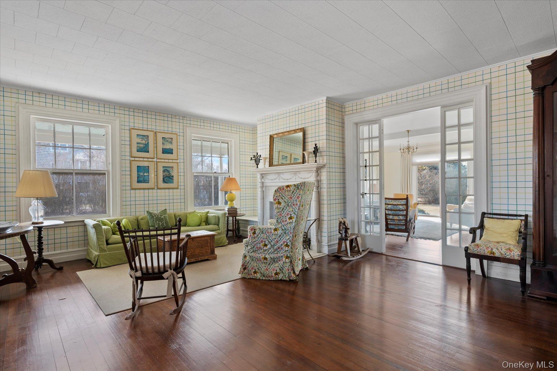 11 Shinnecock Road Quogue, NY 11959 - Photo 17 of 50 a living room with furniture and wooden floor