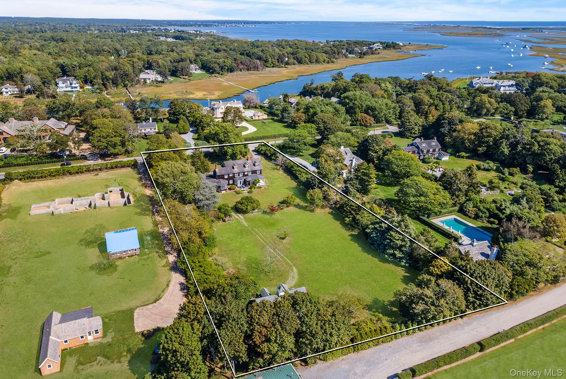 11 Shinnecock Road Quogue, NY 11959 - Photo 2 of 50 a view of a lake with a mountain view