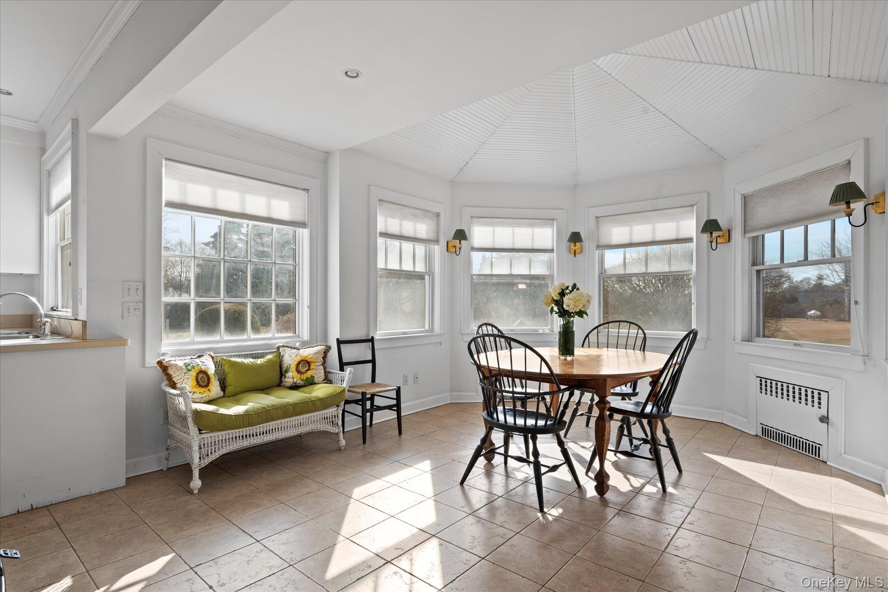11 Shinnecock Road Quogue, NY 11959 - Photo 23 of 50 a dining room with furniture and wooden floor