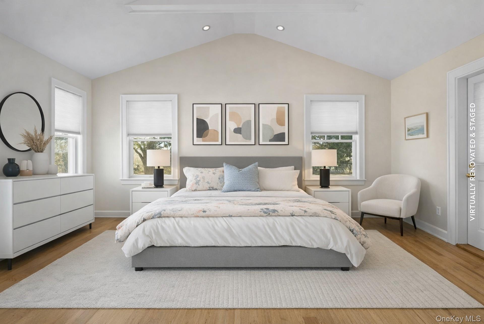 11 Shinnecock Road Quogue, NY 11959 - Photo 24 of 50 a spacious bedroom with a bed a mirror and a window