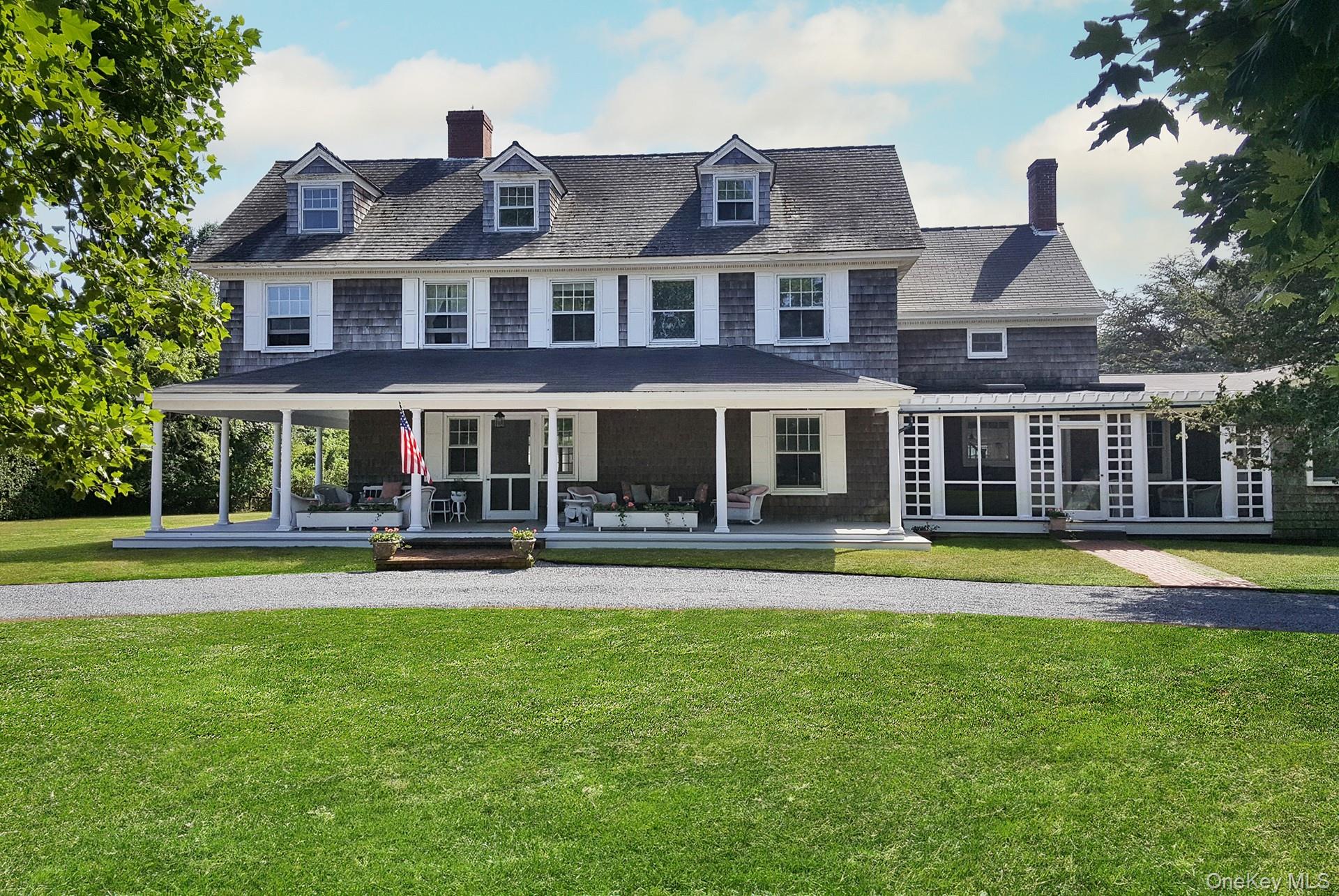 11 Shinnecock Road Quogue, NY 11959 - Photo 3 of 50 a front view of a house with swimming pool having outdoor seating