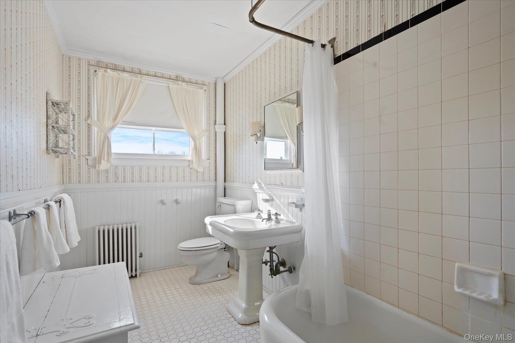 11 Shinnecock Road Quogue, NY 11959 - Photo 37 of 50 a bathroom with a sink a toilet and shower