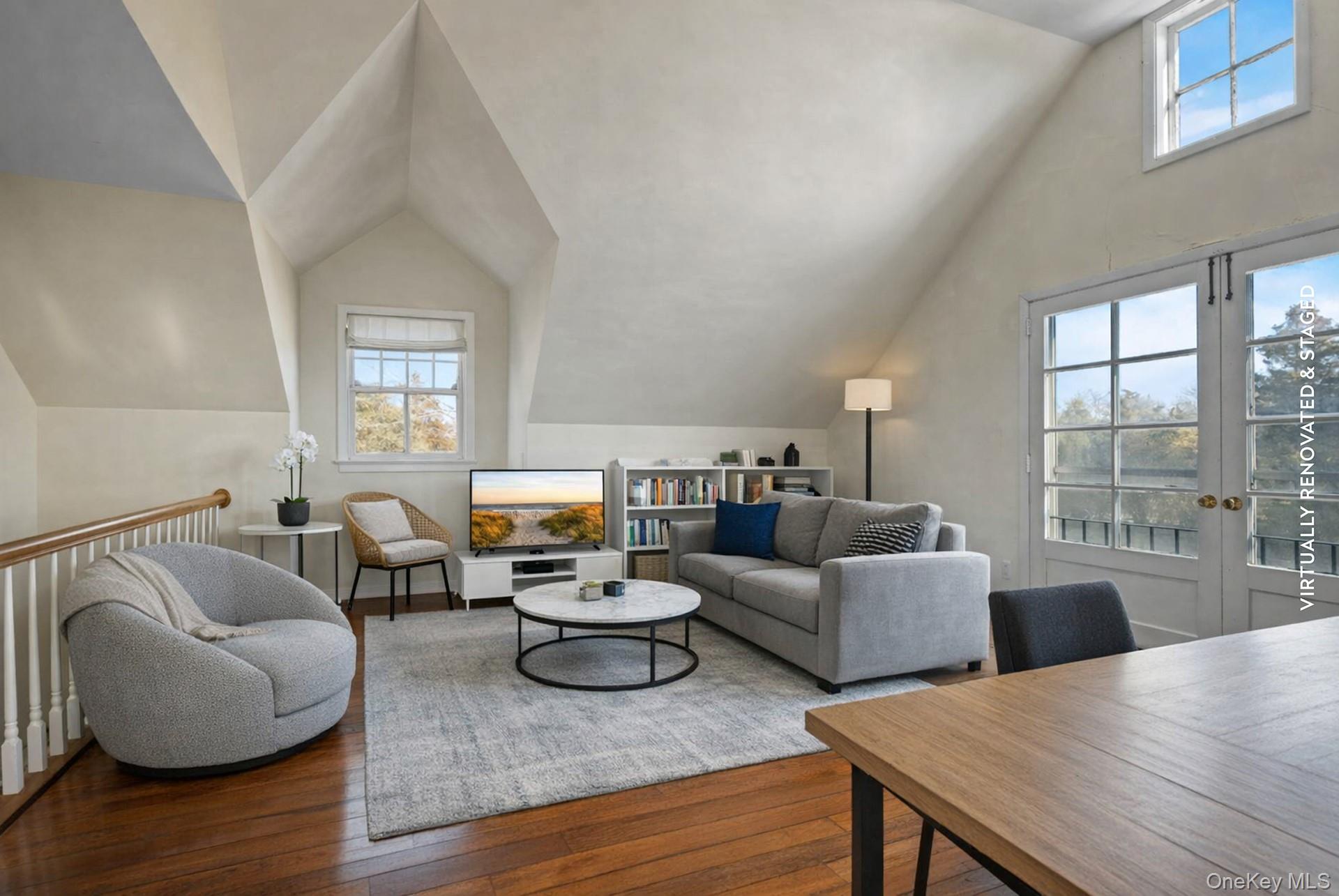 11 Shinnecock Road Quogue, NY 11959 - Photo 45 of 50 a living room with furniture and a large window