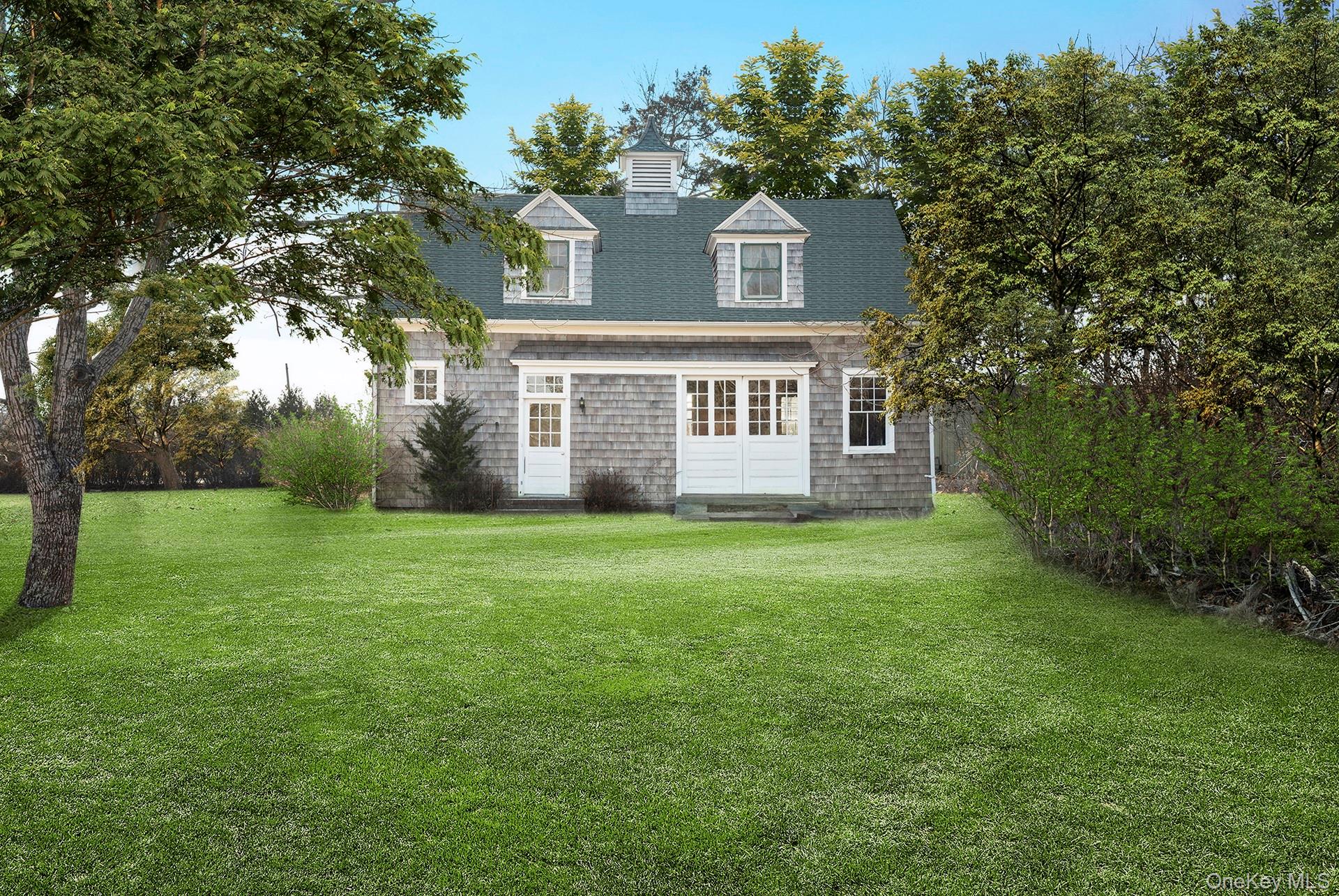 11 Shinnecock Road Quogue, NY 11959 - Photo 8 of 50 a front view of house with yard and green space