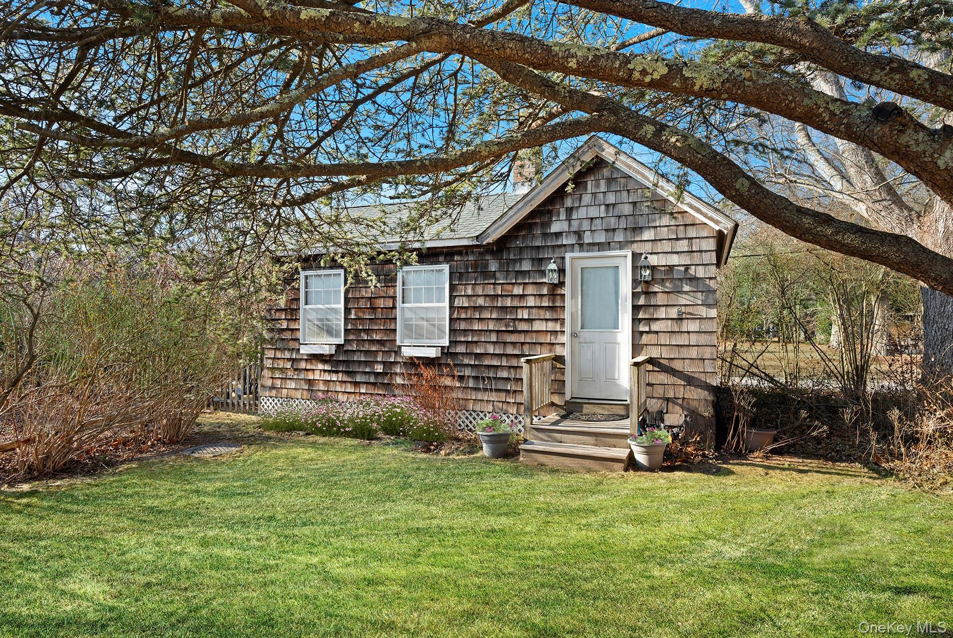 11 Shinnecock Road Quogue, NY 11959 - Photo 9 of 50 a view of a house with a yard
