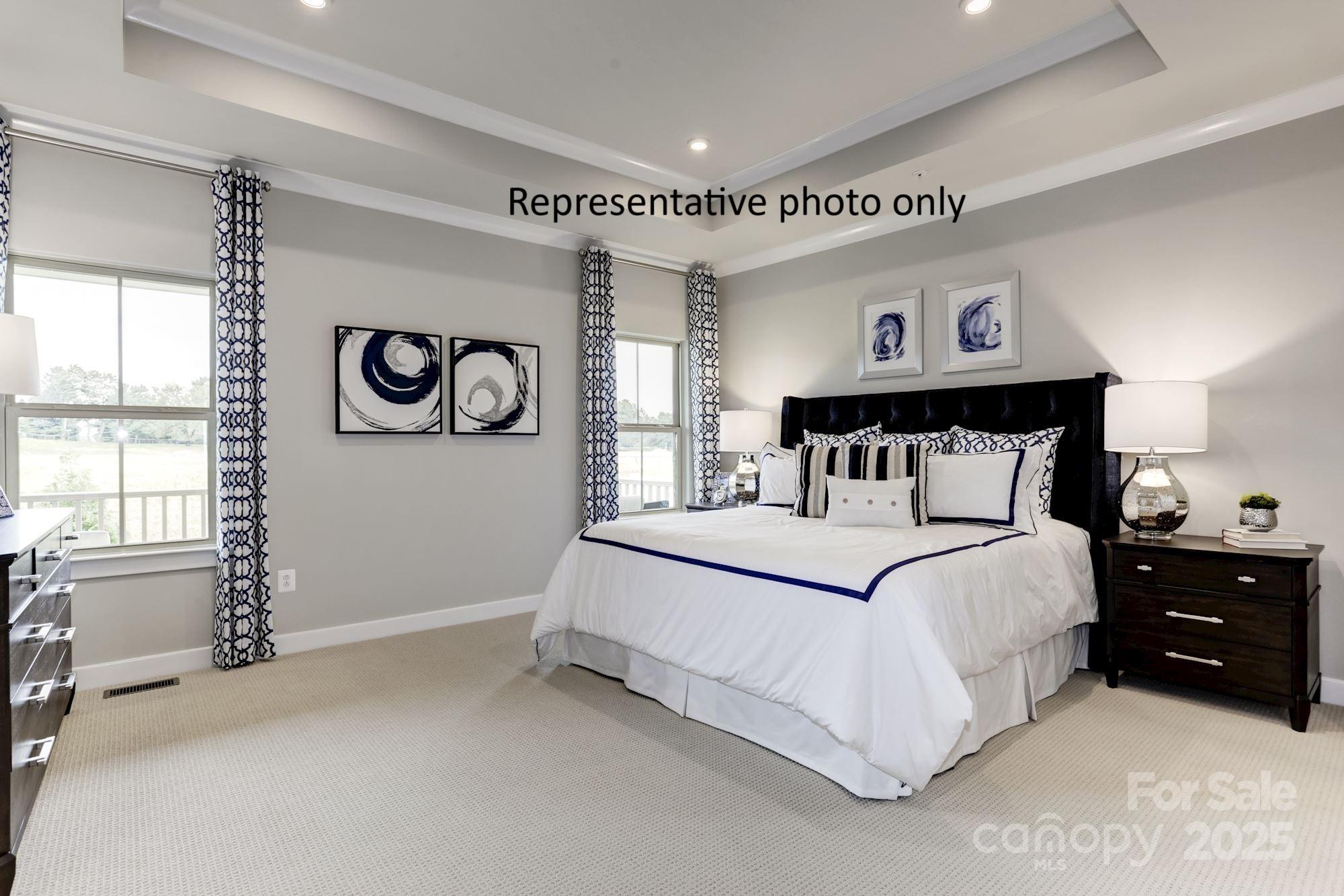 2024 Bramble Hedge Road, Unit 3241 Indian Trail, NC 28079 - Photo 7 of 11 a bedroom with a bed and a window