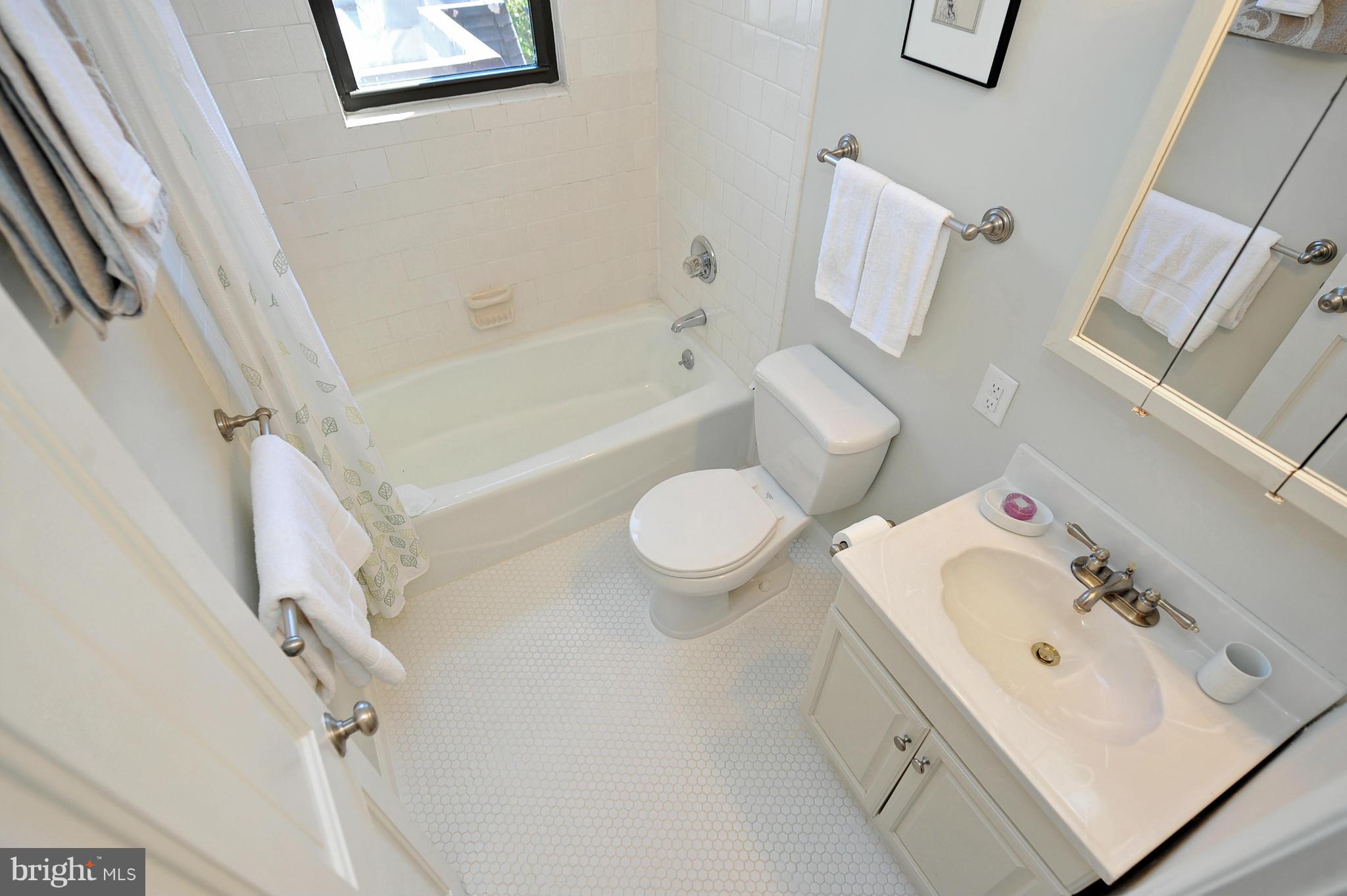 1661 Park Road Northwest, Unit 304 Washington, DC 20010 - Photo 11 of 15 New floor tile in bathroom