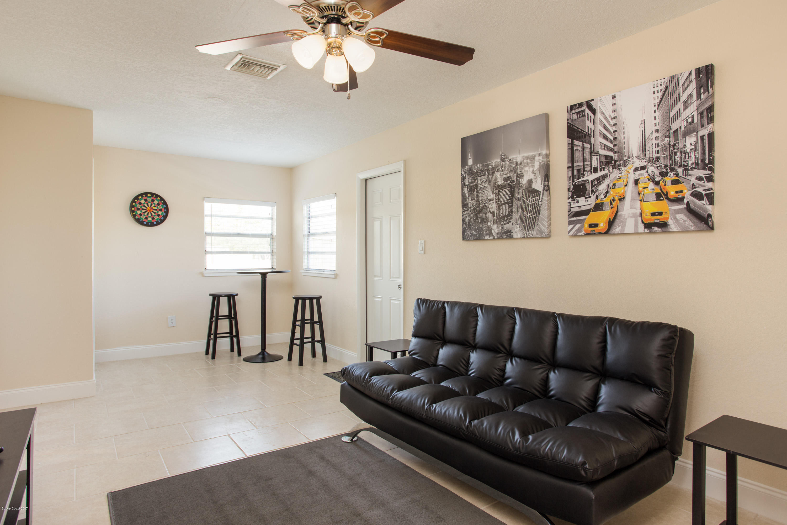 318 West Rutgers Street Melbourne, FL 32901 - Photo 9 of 14 a living room with furniture and a flat screen tv