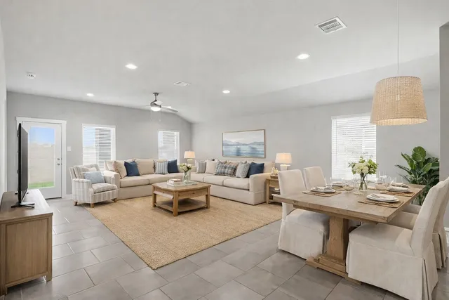 a living room with furniture and a large window