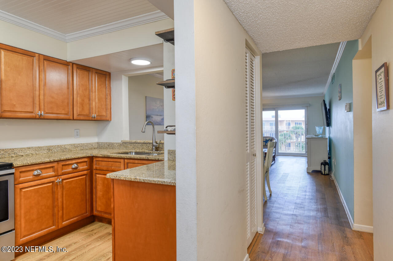 4 Ocean Trace Road, Unit 405 St. Augustine, FL 32080 - Photo 7 of 27 a view of a kitchen with a sink and cabinets