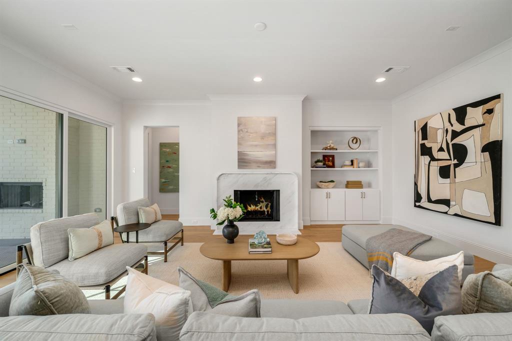 3884 Durango Drive Dallas, TX 75220 - Photo 4 of 16 a living room with furniture and fireplace
